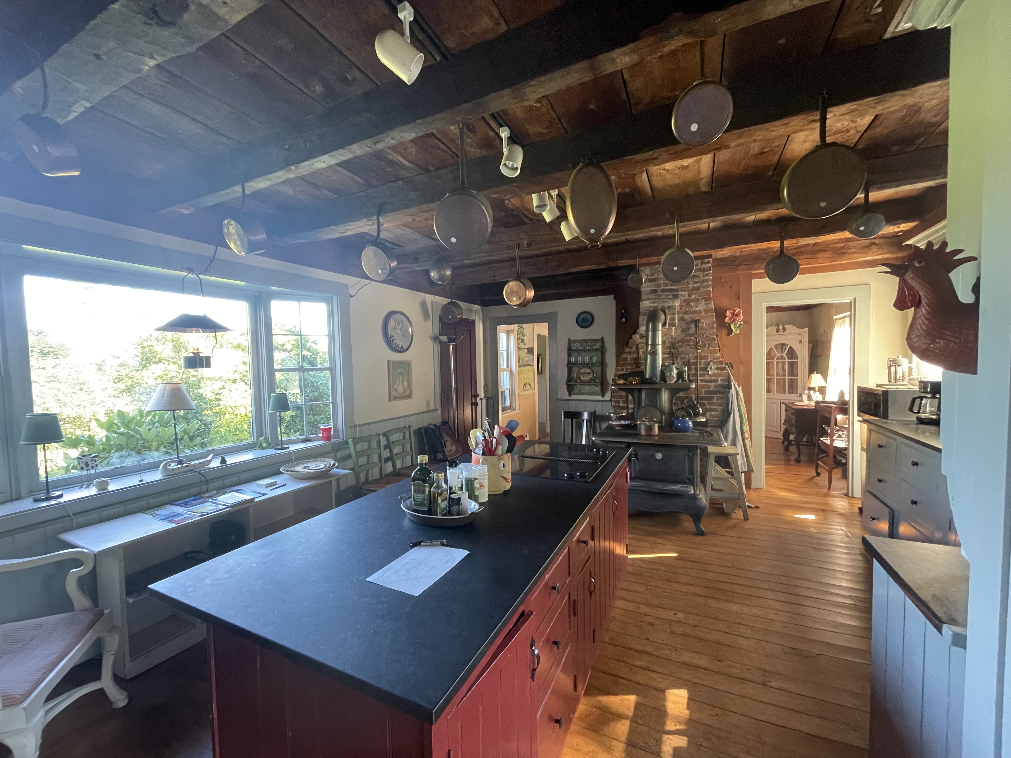 Kitchen with exposed beams and copper pots